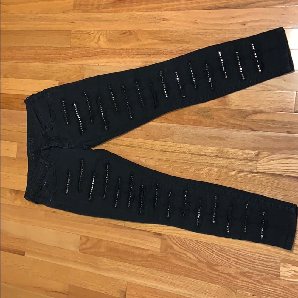 Faded black ripped denim with clear crystals